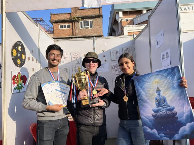 All 3 Project members Karmendra Shrestha is holding the certificate, Joon Shakya is lifting the trophy and Sanskriti Pokharel is lifting the canvas of Gautam Buddha as a winning prizes of SET exhibition.