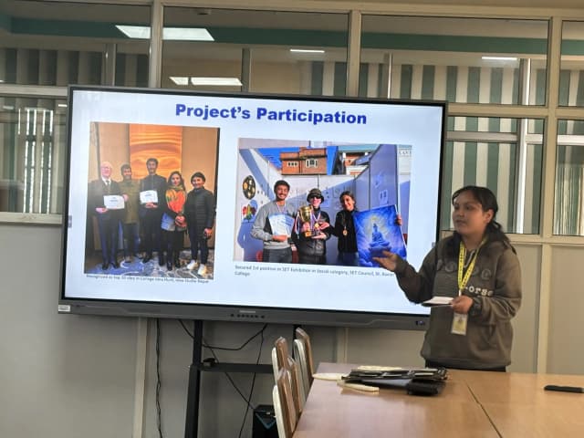 Project member Srijana Katwal is sharing about the participation that Project Wings to Dreams had participated recently. On the screen, project participation, Idea studio and SET Exhibition is being displayed.