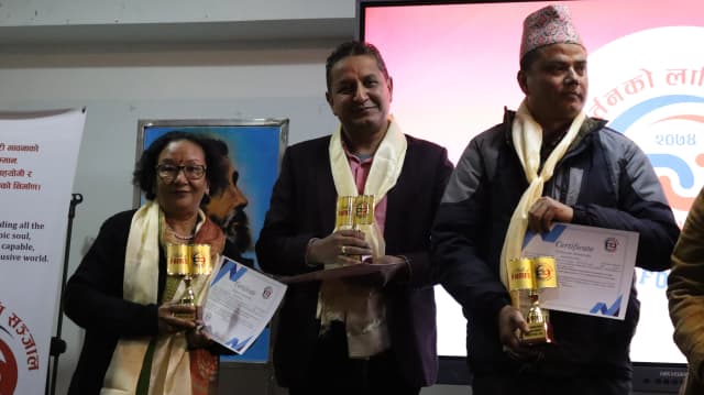 Picture of 3 honorary members Mina Shrestha, Khem Prashain and Devendra Paudel holding their certificates and token of loves.