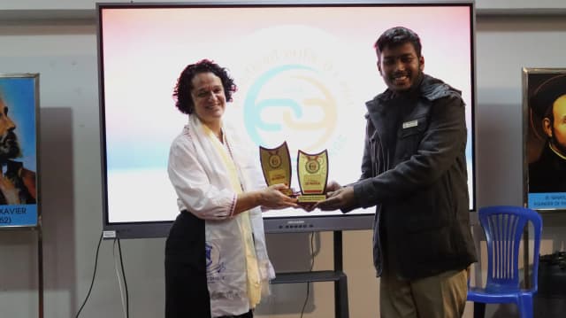 Founder and President - CFC Abhishek Shahi is awarding Fanny Collado representing UPV to hand over the token of love to the donors of 3D printers.