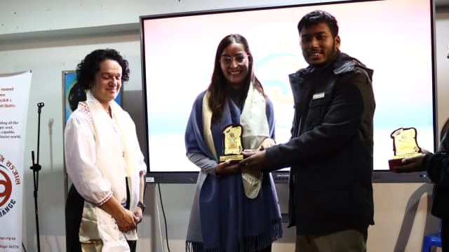 Founder and President - CFC Abhishek Shahi is handing over the Token of Love to Valeria - one of the international intern from UPV and on her side Fanny Collado is also observed.