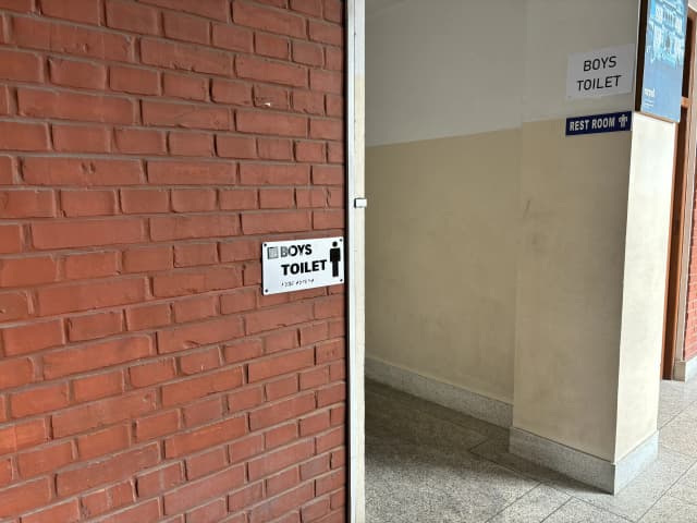 A picture of the location where our accessible signboard of boy's toilet is placed.