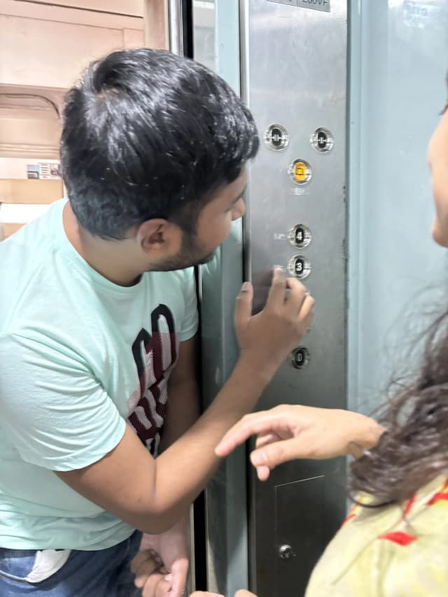 Founder & President of CFC Mr. Abhishek Shahi is touching and reading the braille labels placed in the buttons of lift.