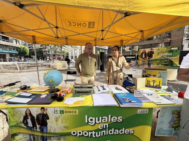 The picture of the stall of Exhibition for the celebration of White Cane Day at Plaza de los Pinazo, Valencia, Spain.