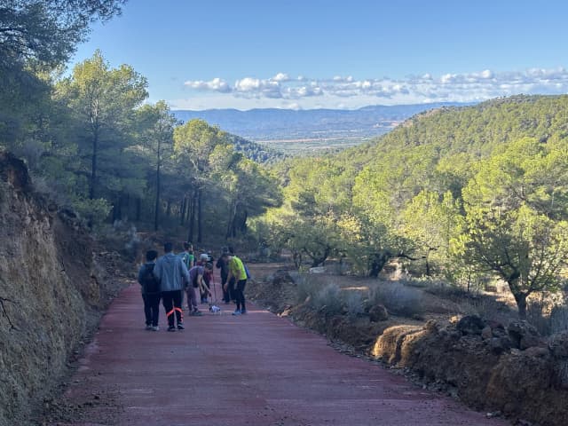 Our founder Abhishek Shahi is being guided by Fanny Collado - the President of Expedición Solidaria. In the background, other participants are also being observed.