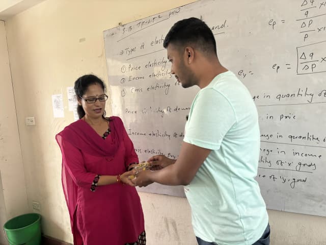 The Founder & President of CFC Mr. Abhishek Shahi is handing over some of the braille cubes to the Blind Section Coordinator of Namuna Machindra School Mrs. Indira Arayal.