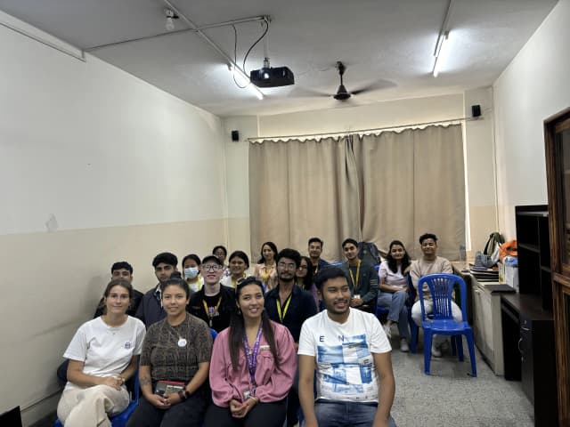 A group picture taken at the event consisting of around 17 individuals including executives, officers, international interns and project members.