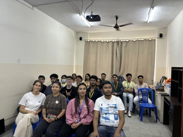 A group picture taken at the event consisting of around 17 individuals including executives, officers, international interns and project members.