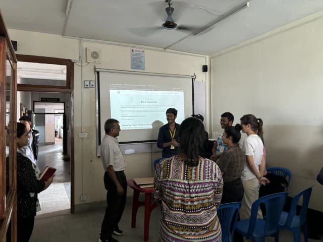 Fr. Jiju Varghese, S.J paying a visit during the event. In the background our Founder, officers, international interns and Anupa ma’am – staff of OICP of St. Xavier’s College, Maitighar is also observed.