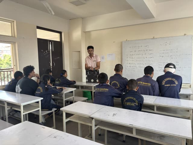 One of our Officers Mr. Karmendra Shrestha is holding the 3D model and explaining about ‘Phases of the Moon’. In front of him, 9 students with visual disabilities and a officer Mr. Sangam Khadka is observed listening.