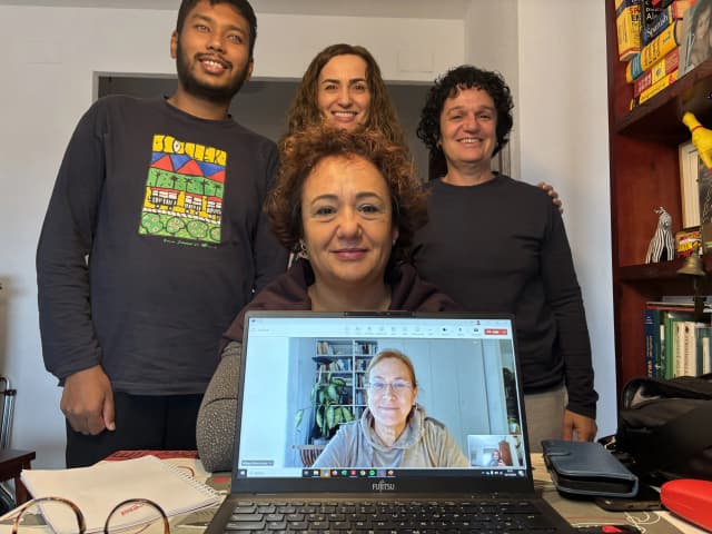 A group picture taken after the completion of the meeting where our Founder Mr. Abhishek Shahi, Ms. Fanny Collado is standing with 2 professors. In the screen, a 3rd professor and our Co-founder and Secretary Ms. Deepika Shahi is also observed.