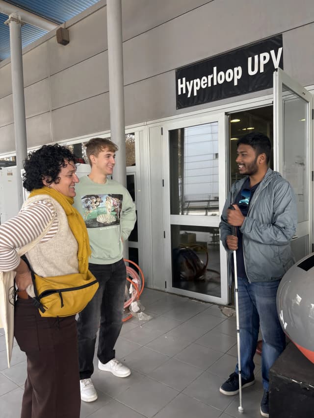 One of the team members from Hyper Loop Project - UPV is explaining our Founder Abhishek Shahi about the levitating train and its working machinism.