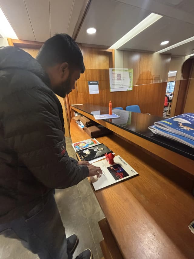 Our Founder Abhishek Shahi is touching one of the Maqueta kept in the ONCE. In the background, there are two of tactile painting of a girl and Picasso.