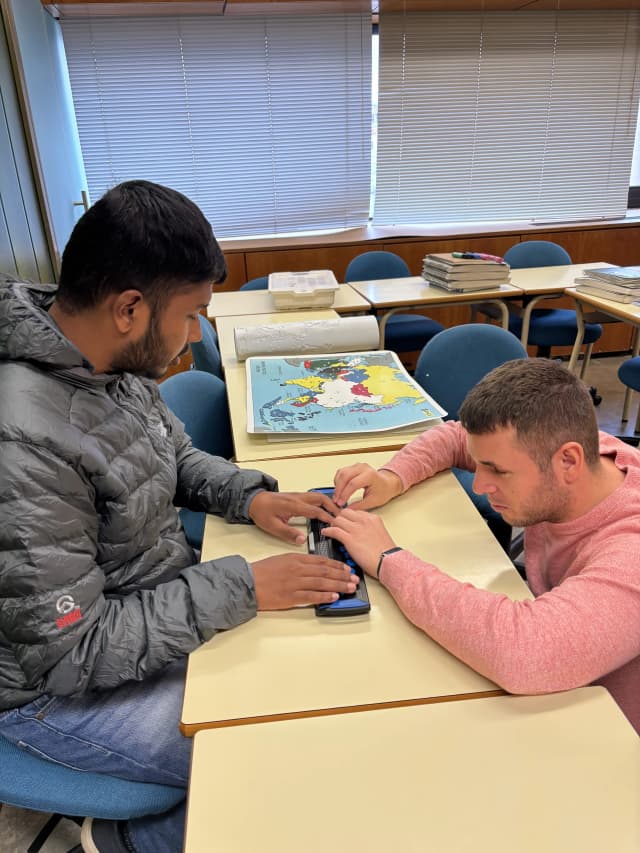 Our Founder Abhishek Shahi is touching the Fusion 14 Braille Sense made from Freedom Scientific. One of the Braille teachers is teaching him to use the machine.