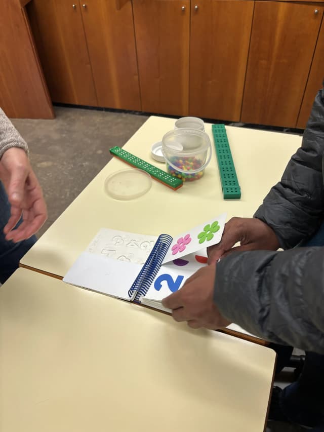 A picture of one of the interactive tactile and braille book, that is used to teach children to count numbers.