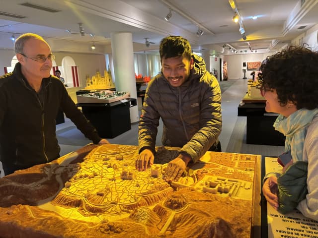 Our Founder Abhishek Shahi is touching the tactile map of a part of place of Spain. He is between Danny and Fanny.