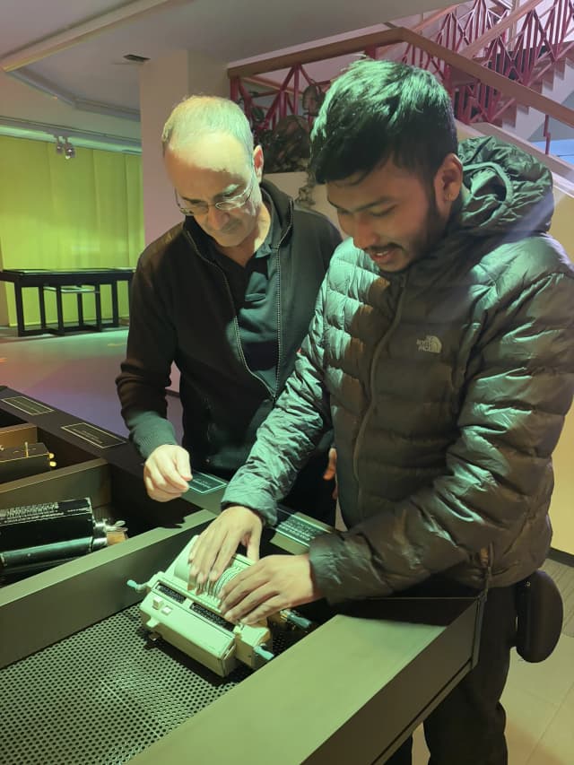 Our Founder Abhishek Shahi is touching one of the antic braille typewriter kept in the museum.