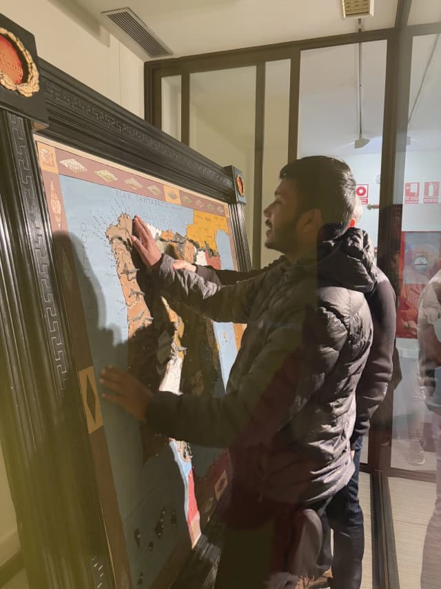 Our Founder Abhishek Shahi is touching the big tactile map of Europe kept in the display. Danny is guiding him in this process.