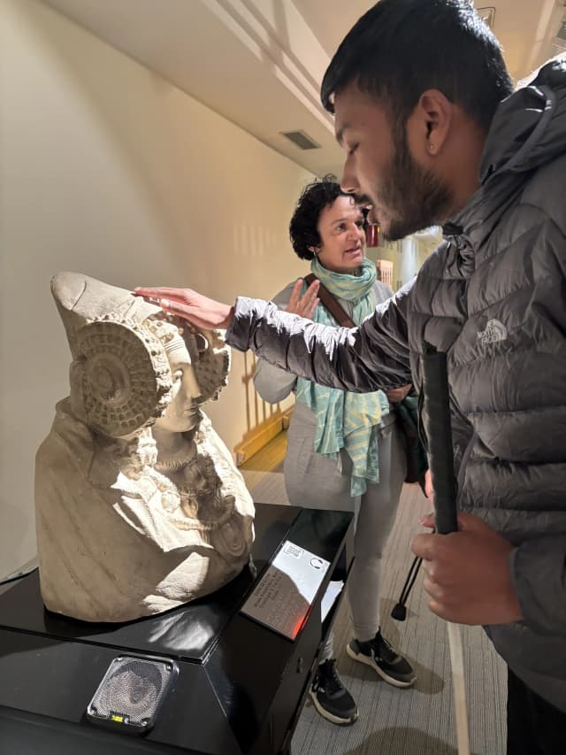 Our Founder Abhishek Shahi is touching a tactile replica of the Lady of Elche (La Dama de Elche), a famous Iberian sculpture, celebrated for its intricate headdress and detailed craftsmanship.