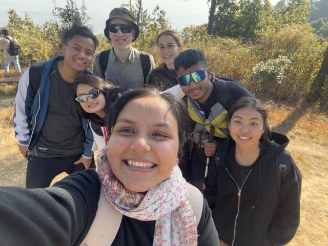 A group selfie of 7 individuals including CFC executives, officers and international intern during the hiking.